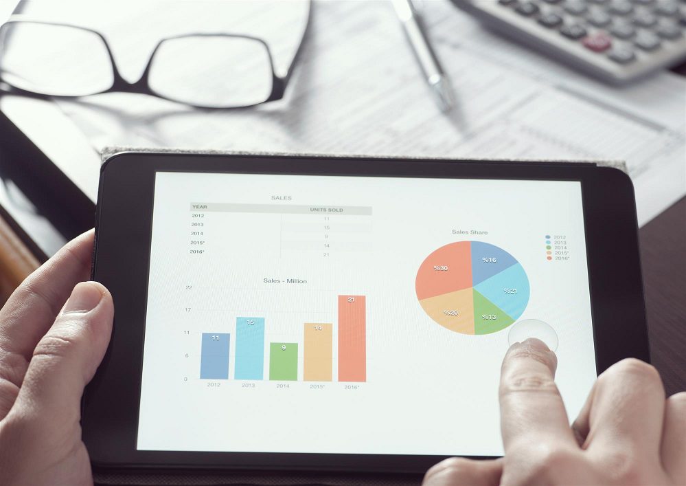 businessman measure financial data on his tablet device