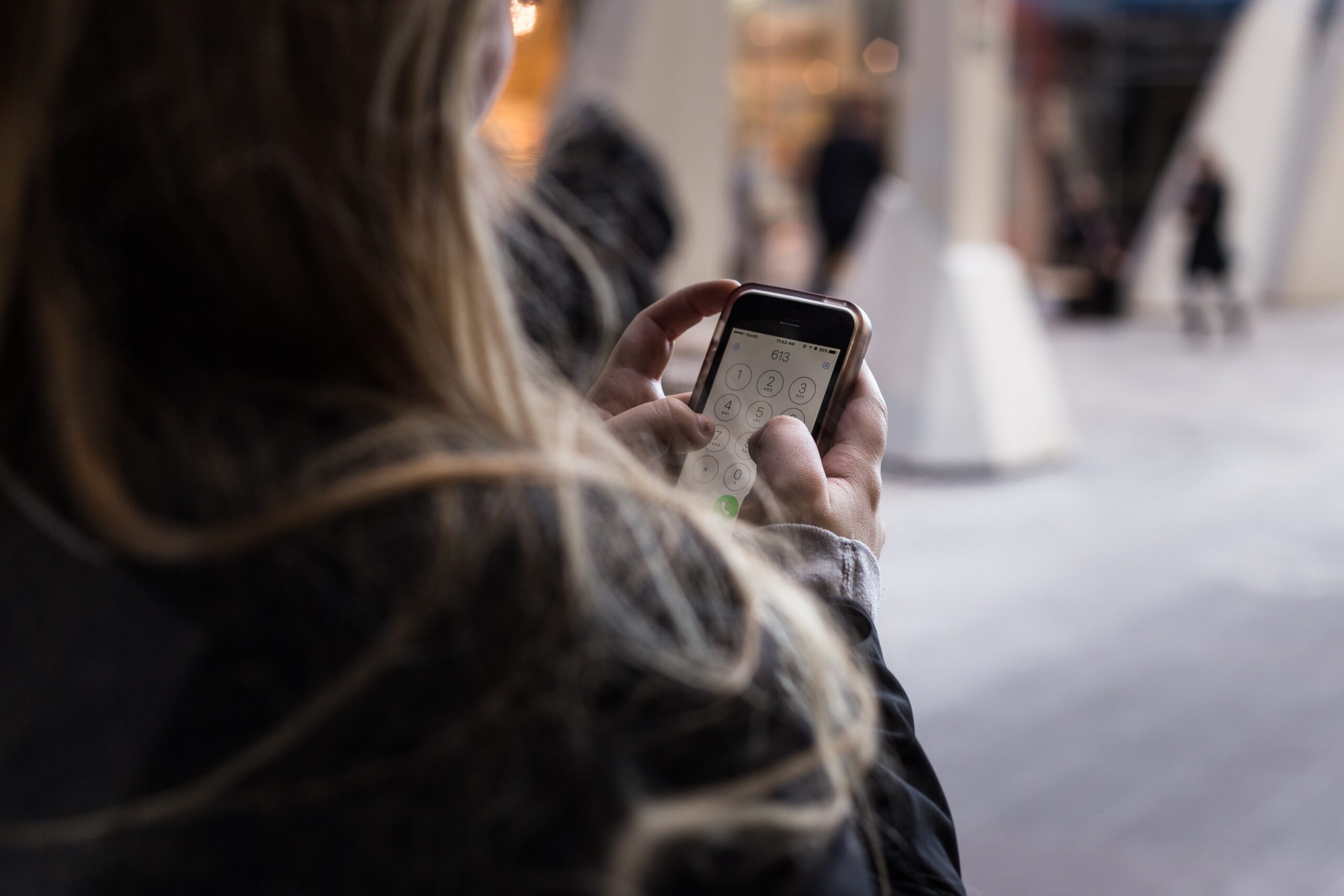 Woman using custom messaging on her phone