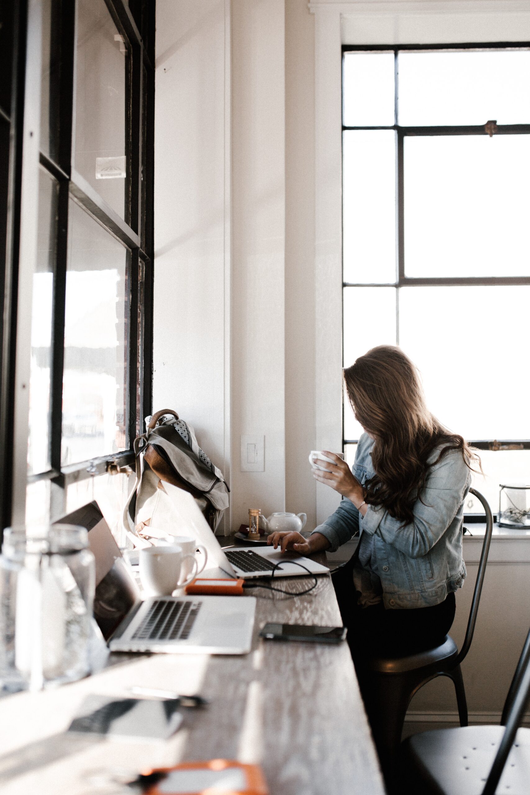 Woman looking at a computer for call features for your small business