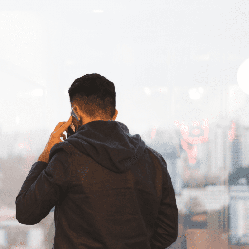 Man talking on the phone after high call volume day