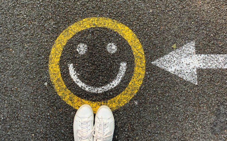 image of a happy face on the ground symbolizing happy customers and excellent qualities of customer service
