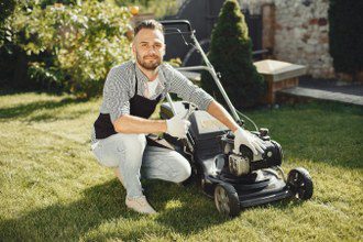 image of a man fixing a lawn mower thinking about if he should hire a virtual assistant