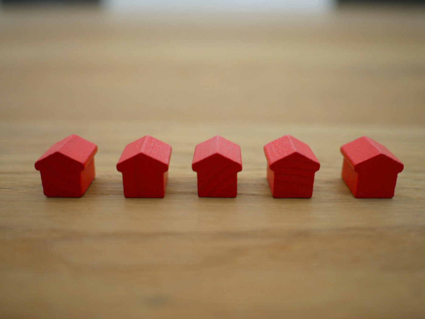 image of small red houses indication property management answering service
